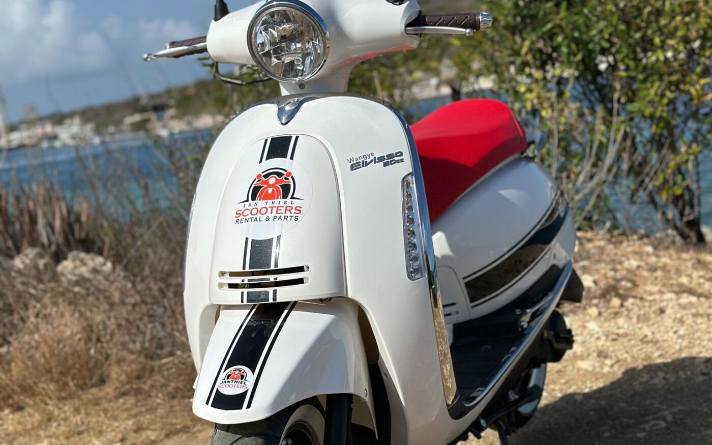 50cc scooter, coastal backdrop