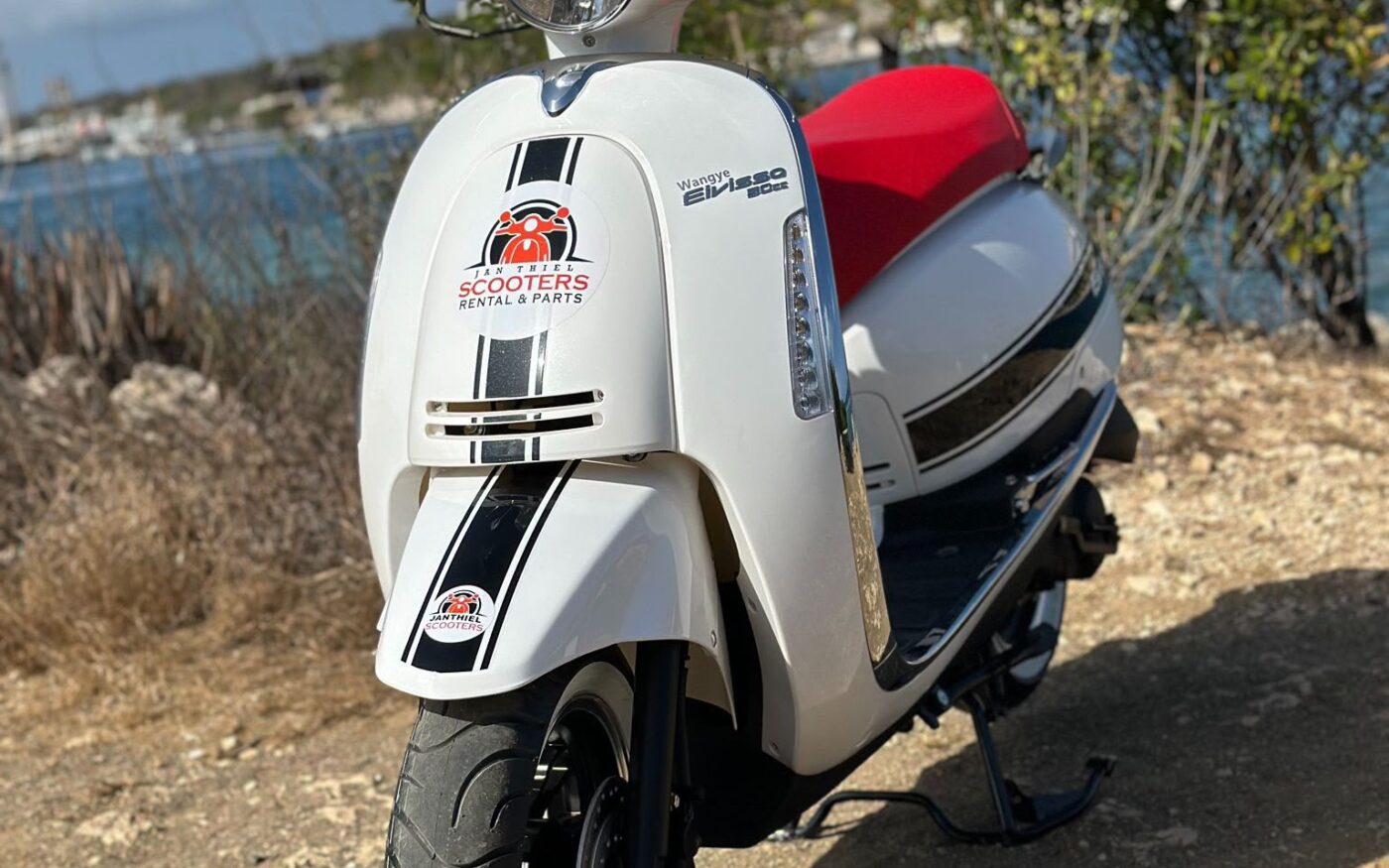 50cc scooter, coastal backdrop