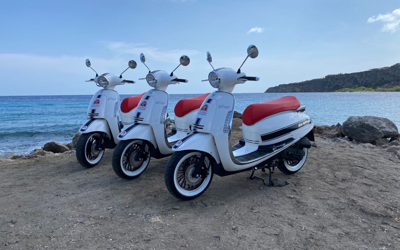 Three scooters, beachfront